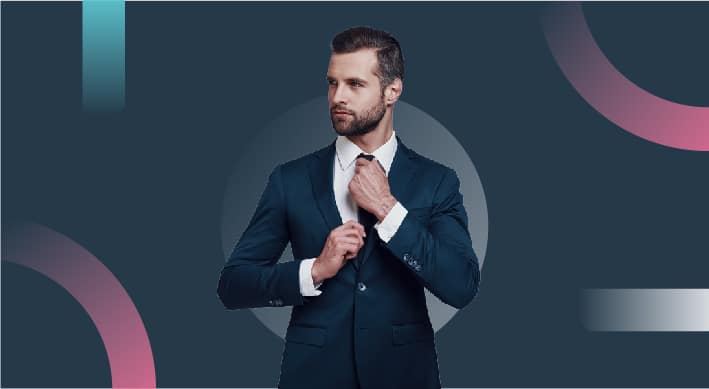 Businessman adjusting his tie on a dark abstract background